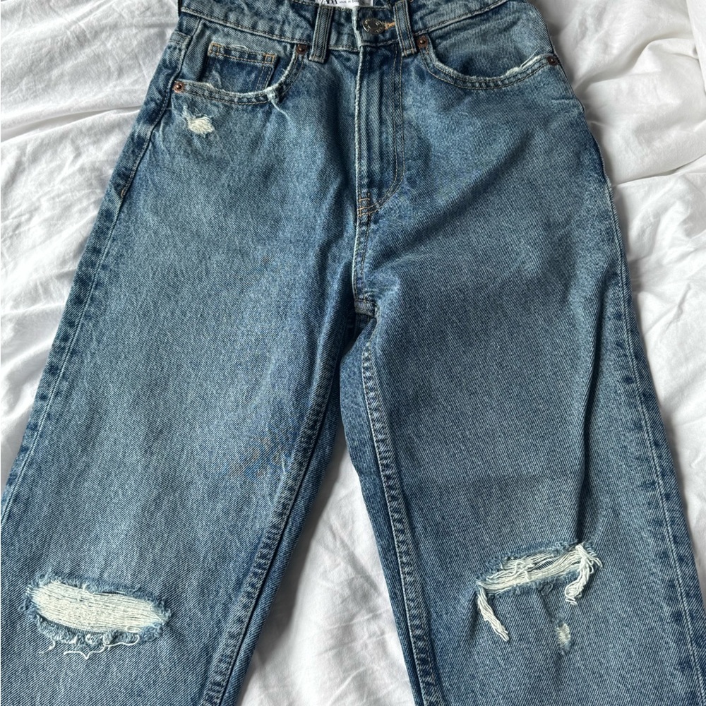 Distressed Blue Jeans